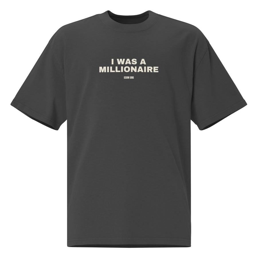 
Supplier mockup of the Faded Black I Was a Millionaire heavyweight tee, front view, showing the oversized silhouette.
