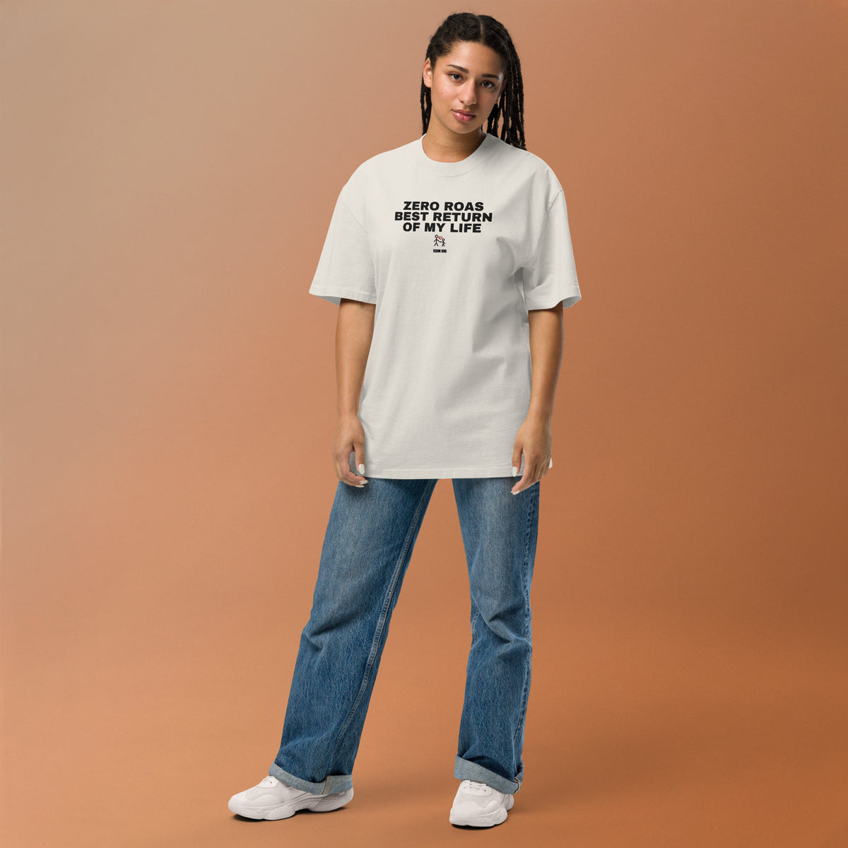 Supplier mockup: model in blue jeans wearing the Faded Bone Zero ROAS, Best Return of My Life tee, with black embroidered headline and adult-and-child heart icon on the front.